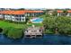 Community dock with picnic table overlooking the water at 1515 Pinellas Bayway S # 65, St Petersburg, FL 33715