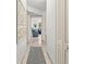 Hallway with access to living room and other rooms at 1515 Pinellas Bayway S # 65, St Petersburg, FL 33715