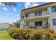 Ground level view of condo building with balcony at 1515 Pinellas Bayway S # 65, St Petersburg, FL 33715