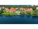 Aerial view of waterfront community with pool and dock at 1515 Pinellas Bayway S # 65, St Petersburg, FL 33715