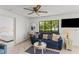 Living room with sofa and view into bedroom at 1515 Pinellas Bayway S # 65, St Petersburg, FL 33715