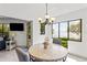 Dining area with table and chairs, water view at 1515 Pinellas Bayway S # 65, St Petersburg, FL 33715