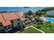Condo building with pool, kayaks, and waterfront views at 1515 Pinellas Bayway S # 65, St Petersburg, FL 33715