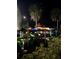 Rack of kayaks at night under palm trees at 1515 Pinellas Bayway S # 65, St Petersburg, FL 33715