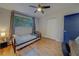 Cozy bedroom with hardwood floors and a twin-size bed at 1420 54Th N Ave, St Petersburg, FL 33703