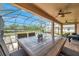 Relaxing screened-in patio with pool view and outdoor dining at 116 Caladium Ct, Bradenton, FL 34212