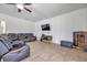 Gathering room with leather sectional and wood-look floors at 116 Caladium Ct, Bradenton, FL 34212