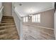 Carpeted staircase leading to the upper level of the home at 116 Caladium Ct, Bradenton, FL 34212