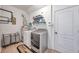 Laundry room includes washer, dryer, and shelving at 116 Caladium Ct, Bradenton, FL 34212