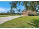 House exterior with basketball court and paver driveway at 116 Caladium Ct, Bradenton, FL 34212