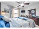 Cozy bedroom with ceiling fan, window, and dresser at 116 Caladium Ct, Bradenton, FL 34212