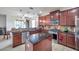 Spacious kitchen with island, stainless steel appliances, and granite countertops at 116 Caladium Ct, Bradenton, FL 34212