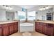 Bathroom with double vanity, corner soaking tub, and tile floors at 116 Caladium Ct, Bradenton, FL 34212