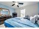 Bright bedroom with a large bed, dresser, and TV at 116 Caladium Ct, Bradenton, FL 34212
