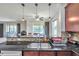 Modern kitchen with double sink, granite countertops, and stainless steel appliances at 116 Caladium Ct, Bradenton, FL 34212