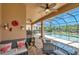 Screened patio with seating area, and lovely pool view at 116 Caladium Ct, Bradenton, FL 34212