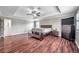 Primary bedroom with wood floors, large windows and en-suite bathroom at 116 Caladium Ct, Bradenton, FL 34212