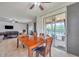 Dining area with view of living room, pool, and backyard at 116 Caladium Ct, Bradenton, FL 34212