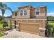 Two-story house with stone accents and a two-car garage at 116 Caladium Ct, Bradenton, FL 34212