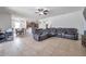 Open Gathering room with leather sectional and view of dining area at 116 Caladium Ct, Bradenton, FL 34212