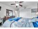 Relaxing bedroom with ceiling fan, window, and double door closet at 116 Caladium Ct, Bradenton, FL 34212