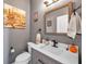 Stylish powder room with gray walls and modern vanity at 116 Caladium Ct, Bradenton, FL 34212