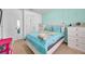 Bedroom with white furniture and a teal comforter at 116 Caladium Ct, Bradenton, FL 34212