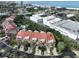 Aerial view of condo building near beach and shopping at 4654 Mirabella Ct, St Pete Beach, FL 33706