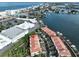 Aerial view showcasing property's proximity to shopping and waterfront at 4654 Mirabella Ct, St Pete Beach, FL 33706