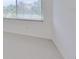 Bedroom with window and carpet at 4654 Mirabella Ct, St Pete Beach, FL 33706