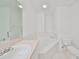 Bathroom with bathtub, toilet and vanity at 4654 Mirabella Ct, St Pete Beach, FL 33706