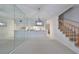 Dining area with mirrored wall and view into kitchen at 4654 Mirabella Ct, St Pete Beach, FL 33706