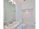 Clean bathroom with a bathtub, toilet, and sink at 4654 Mirabella Ct, St Pete Beach, FL 33706