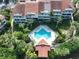 Aerial view of community pool and surrounding landscape at 4654 Mirabella Ct, St Pete Beach, FL 33706