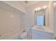 Clean bathroom with toilet, tub, and vanity at 4654 Mirabella Ct, St Pete Beach, FL 33706