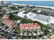 Aerial view of condo building near beach and shopping at 4654 Mirabella Ct, St Pete Beach, FL 33706