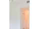 Bedroom with door and ceiling fan at 4654 Mirabella Ct, St Pete Beach, FL 33706