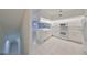 White kitchen features ample counter space and cabinets at 4654 Mirabella Ct, St Pete Beach, FL 33706