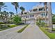 Two story townhome with attached garage and lush landscaping at 4654 Mirabella Ct, St Pete Beach, FL 33706