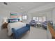 Spacious bedroom with seating area and windows at 4654 Mirabella Ct, St Pete Beach, FL 33706