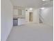 Spacious basement recreation room with wet bar and built-in storage at 4654 Mirabella Ct, St Pete Beach, FL 33706