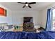 Living room with large TV, comfortable seating, and wood floors at 8556 Southern Charm Cir, Brooksville, FL 34613