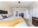 Main bedroom with king-size bed, dresser, and en-suite bathroom at 8556 Southern Charm Cir, Brooksville, FL 34613