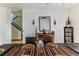 Dining room with hardwood floors, a large table, and stylish decor at 8556 Southern Charm Cir, Brooksville, FL 34613