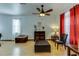 Living room with hardwood floors, comfortable seating, and ceiling fan at 8556 Southern Charm Cir, Brooksville, FL 34613