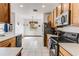 Spacious kitchen with stainless steel appliances and ample wood cabinets at 8556 Southern Charm Cir, Brooksville, FL 34613