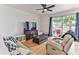 Relaxing living area featuring light floors and sliding glass doors at 8556 Southern Charm Cir, Brooksville, FL 34613
