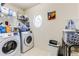Laundry room with washer, dryer, and shelving at 8556 Southern Charm Cir, Brooksville, FL 34613