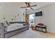 Bedroom with a daybed, TV, and ample closet space at 8556 Southern Charm Cir, Brooksville, FL 34613