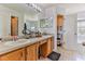Double vanity bathroom with a separate shower and tub at 8556 Southern Charm Cir, Brooksville, FL 34613